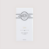 Front of Saratoga Chocolate Co. Latte Bar wrapped in a white paper package with a soft tan flavor label. Label features the Saratoga Chocolate Co. logo and describes the bar as white chocolate and coffee. This bar is gluten free.
