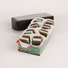 Saratoga Chocolate Co holiday box of mint meltaways, featuring smooth, square-shaped chocolates with a one square mint layer inside showing through, arranged in a black box with a clear top opening