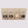 Four bags of Saratoga Chocolate Bark from left to right: Raspberry Almon, Strawberry Hazelnut, Berries & Cream, Cherry Pistachio.