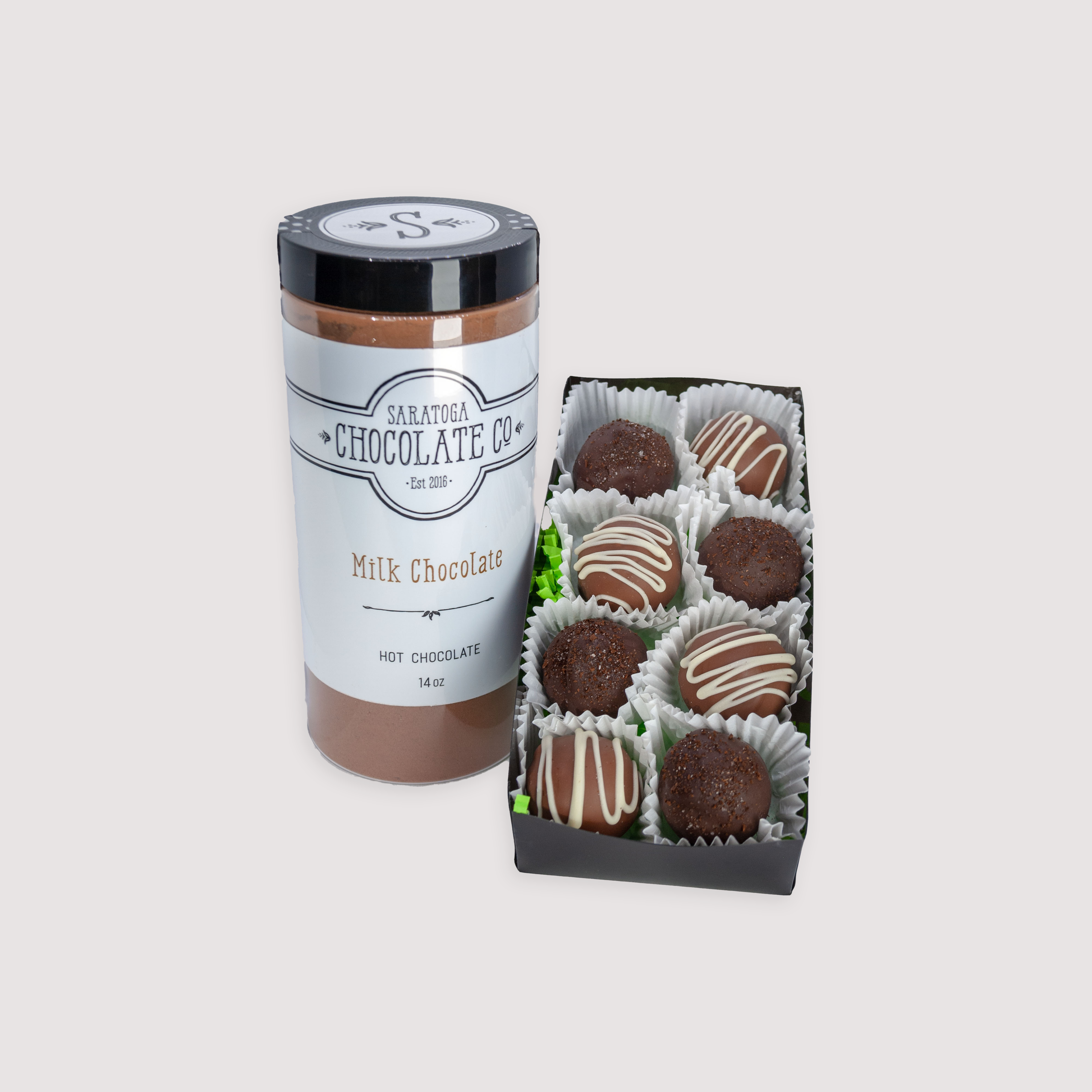 Saratoga Chocolate Co. St. Patrick’s Day chocolate bundle, available in small or large sizes. The large option includes four handmade Irish Cream and four Irish Coffee truffles paired with a large jar of milk chocolate hot chocolate mix. A festive gift set perfect for celebrating with or without a splash of Irish cream or liqueur.