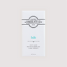 Front of Saratoga Chocolate Co. Bodhi Bar wrapped in a white paper package with a teal-colored flavor label. The label features the Saratoga Chocolate Co. logo and describes the bar as milk chocolate with crispy organic puffed brown rice and crunchy organic puffed quinoa. This bar is gluten free.
