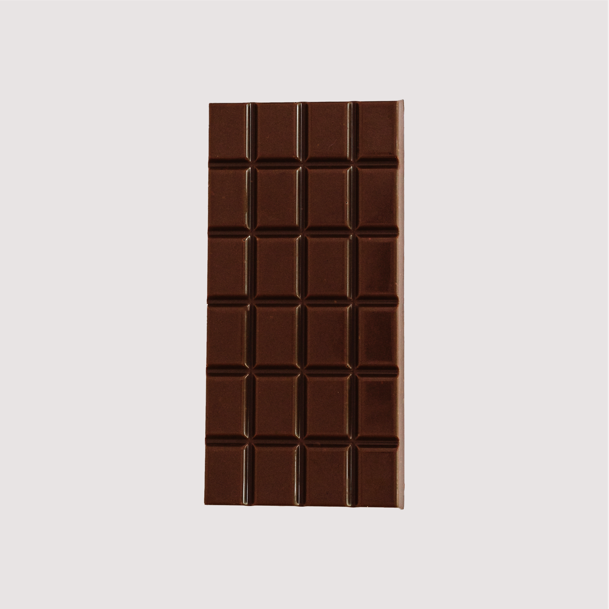 Unwrapped Saratoga Chocolate Co. Bodhi Bar, front side showing a smooth milk chocolate surface divided into 24 square segments. This bar is gluten free.