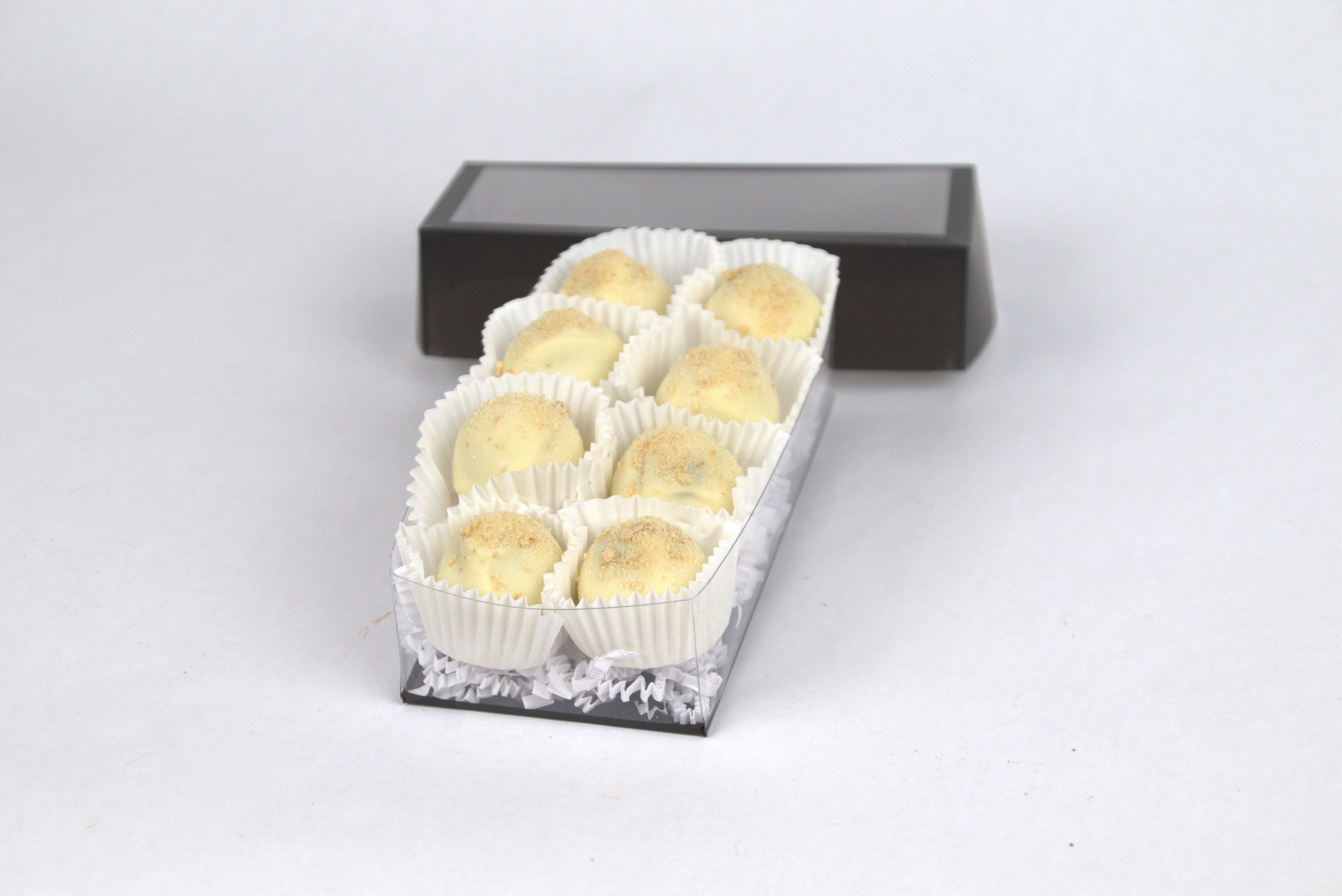 Box of eight Key Lime Pie Truffles, each with tart and silky key lime ganache inside smooth milk chocolate shells, topped with graham cracker pie crust crumbles — a dessert-inspired treat from Saratoga Chocolate Co.