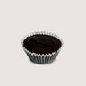 A single Dark Chocolate Peanut Butter Cup in a white paper cup, set on a light background. The dark chocolate shell is smooth and glossy, emphasizing its rich color and texture.