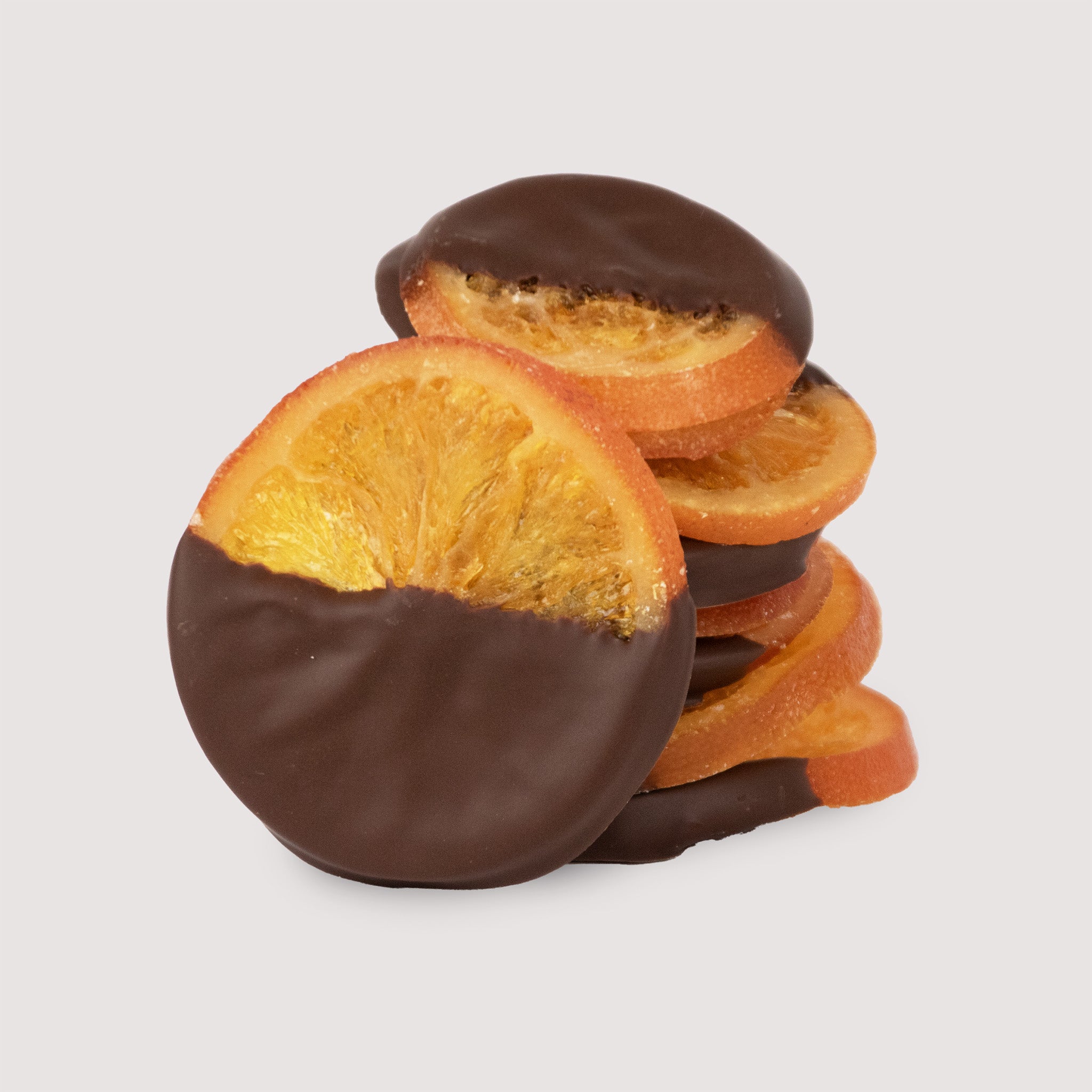 Chocolate-dipped orange slices on a light gray background