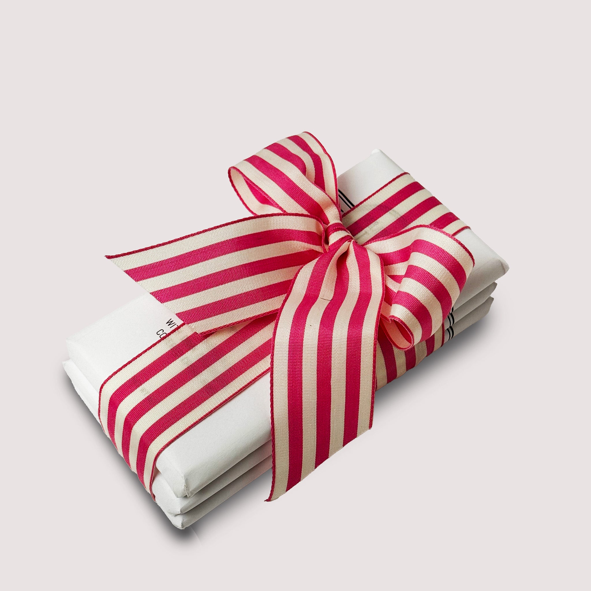 Valentine’s Day Trio gift set featuring three chocolate bars tied together with a pink and white ribbon