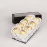 Box of 8 cappuccino truffles by Saratoga Chocolate Co covered with white chocolate, arranged in a sleek black box with each truffle nestled in a paper cup
