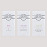 Three Saratoga Chocolate Co. dark chocolate bars in white wrappers with colorful text: Velvet, Fleur de Sel and Genmai Cha, displayed side by side on a light background.