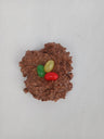 Milk chocolate blended with toasted coconut flakes, shaped into a small nest with three brightly colored jellybeans in the center. These delightful treats look like jellybean "eggs" nestled in a milk chocolate coconut "nest".
