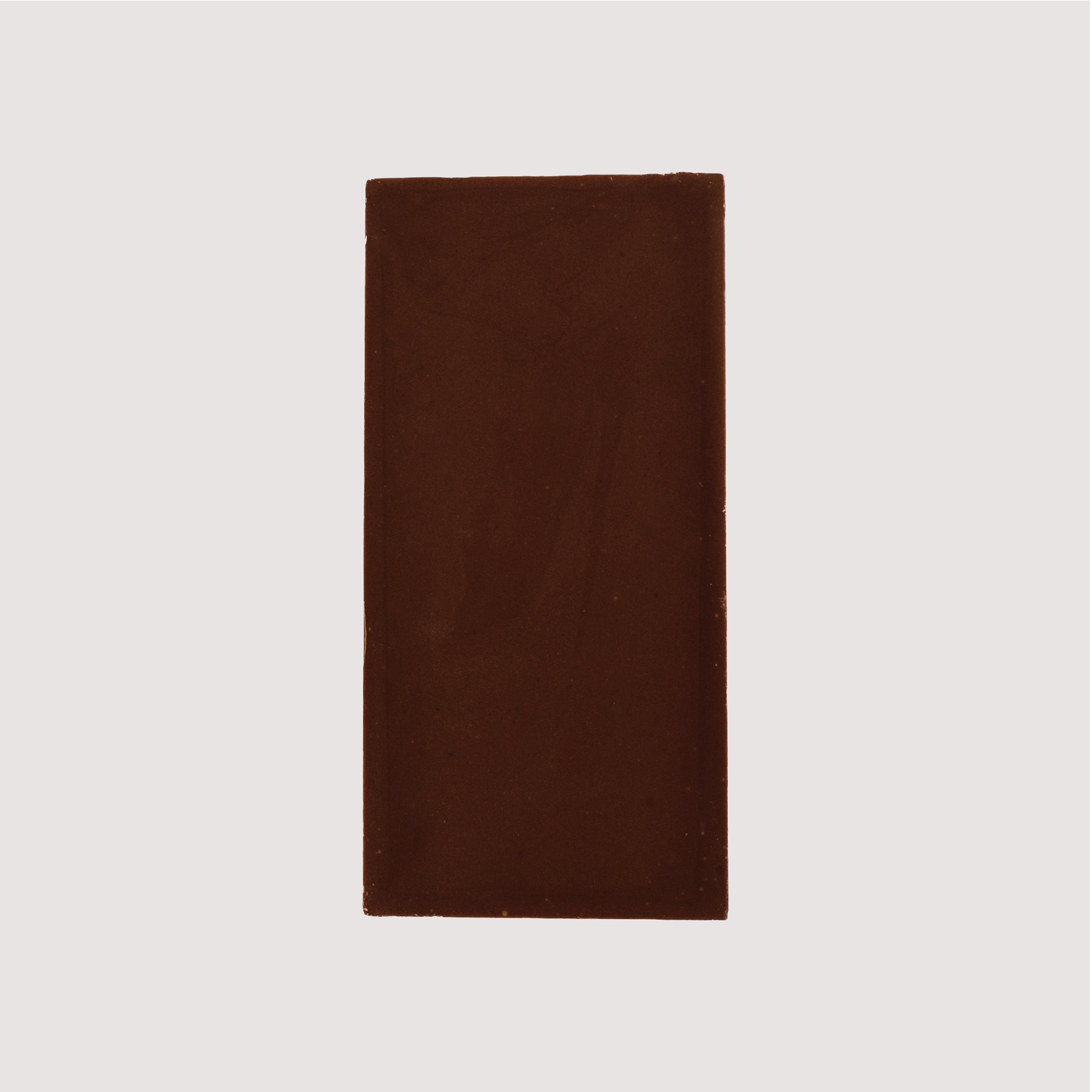 Unwrapped Saratoga Chocolate Co. Milk Bar, back side revealing a milk chocolate surface. This bar is gluten free.